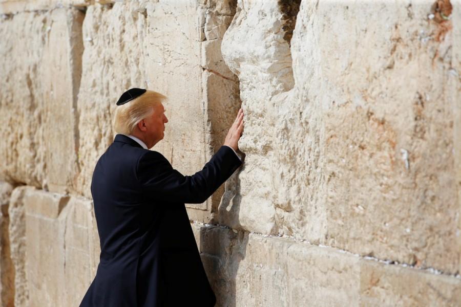 U.S. President Donald Trump touches the Western Wall, Judaism's holiest prayer site, in Jerusalem's Old City May 22, 2017. Donald Trump,Trump,Trump makes historic visit to Western Wall,Trump visits Western Wall,Western Wall,Jerusalem,Jerusalem's Western Wall,Ivanka Trump,Melania Trump