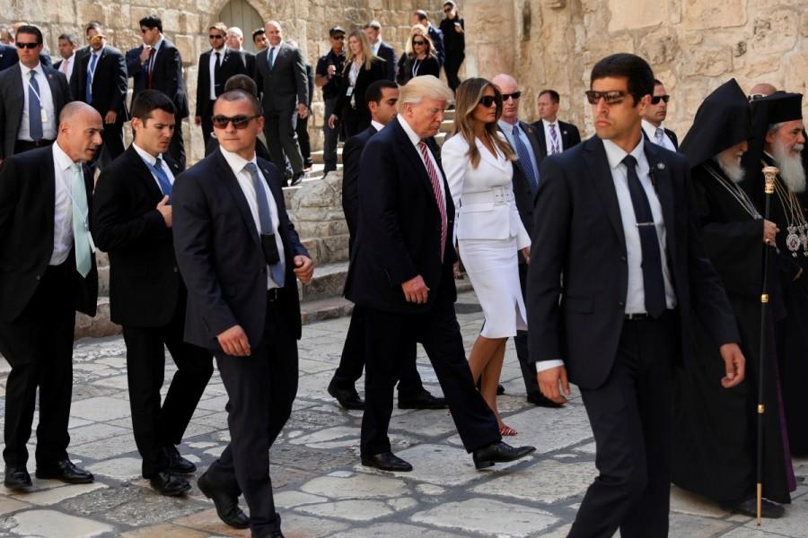President Trump and first lady Melania Trump walk into the entrance to the Church of the Holy Sepulchre in Jerusalem. Donald Trump,Trump,Trump makes historic visit to Western Wall,Trump visits Western Wall,Western Wall,Jerusalem,Jerusalem's Western Wall,Ivanka Trump,Melania Trump