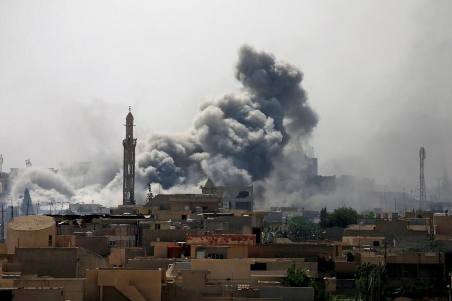Smoke rises from an airstrike during a battle between Iraqi forces and Islamic State militants in western Mosul. Endgame in Mosul,Mosul,Mosul Endgame,recapture Mosul,Islamic State militants,Islamic State