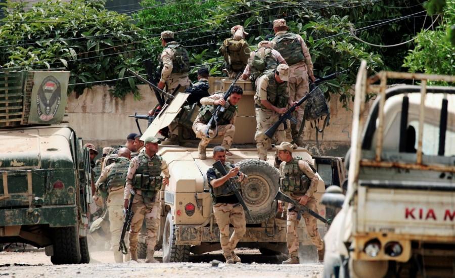 Iraqi rapid response forces gather during a battle against Islamic State militants in Mosul. Endgame in Mosul,Mosul,Mosul Endgame,recapture Mosul,Islamic State militants,Islamic State