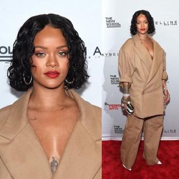 Barbadian singer Robyn Rihanna Fenty flaunts her short curly hair.