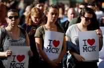 Women wait to take part in a vigil for the victims of an attack on concert goers at Manchester Arena, in central Manchester, Britain May 23, 2017.