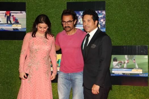 Former Indian cricket player Sachin Tendulkar, Anjali Tendulkar and Bollywood actor Aamir Khan during the premiere of film Sachin: A Billion Dreams in Mumbai on May 24, 2017.