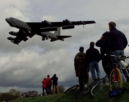 A B-52 bomber is watched by a group of curious onlookers as it lands at RAF Fairford, February 21, 1999. The B52s arrived from the U.S.A. as part of NATO's preparations for air attacks on Yugoslavia as tensions in the Kosovo crisis increased.