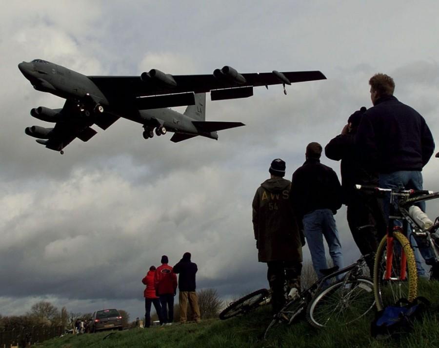 A B-52 bomber is watched by a group of curious onlookers as it lands at RAF Fairford, February 21, 1999. The B52s arrived from the U.S.A. as part of NATO's preparations for air attacks on Yugoslavia as tensions in the Kosovo crisis increased. Treaty Organization,North American Treaty Organization,NATO in the modern world,NATO