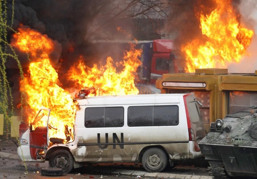 French NATO peacekeeping vehicles burn during clashes with Serb protesters in the ethnically divided city of Mitrovica March 17, 2008. NATO troops came under automatic weapons fire during Serb riots in the northern Kosovo flashpoint town of Mitrovica on Monday, a French NATO spokesman told Reuters. Treaty Organization,North American Treaty Organization,NATO in the modern world,NATO