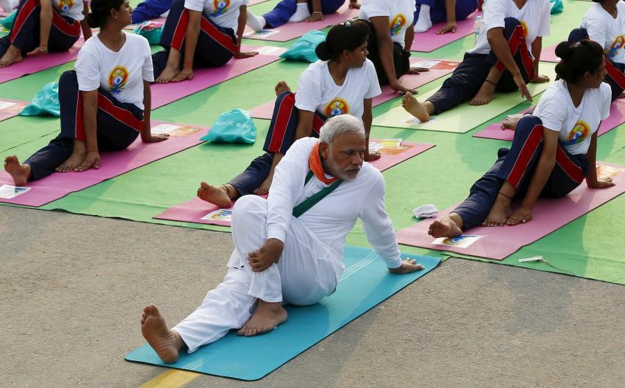 India's Prime Minister Narendra Modi participates in a yoga session to mark International Day of Yoga, in New Delhi, India, June 21, 2015. Narendra Modi,PM Narendra Modi,Modi,PM Modi,3 yrs of Narendra Modi govt,Narendra Modi government turns 3,NaMo,NaMo 3 years
