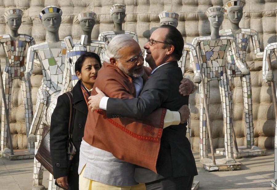 India's Prime Minister Narendra Modi hugs France's President Francois Hollande (R) during their visit to the Rock Garden in Chandigarh, India, January 24, 2016. Prime Minister Narendra Modi,Narendra Modi,Narendra Modi hugs,Modi special,3 years of Modi,3 years of Narendra Modi