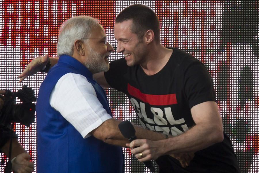 India's Prime Minster Narendra Modi hugs actor Hugh Jackman on stage during the Global Citizen Festival concert in Central Park, New York September 27, 2014. Prime Minister Narendra Modi,Narendra Modi,Narendra Modi hugs,Modi special,3 years of Modi,3 years of Narendra Modi