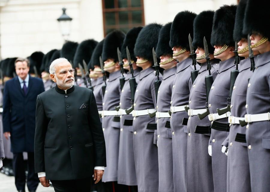 India's Prime Minister Narendra Modi's is followed by Britain's Prime Minister David cameron as he inspects an honour guard during his official visit, in London, November 12, 2015. Narendra Modi,PM Narendra Modi,Modi,PM Modi,3 yrs of Narendra Modi govt,Narendra Modi government turns 3,NaMo,NaMo 3 years