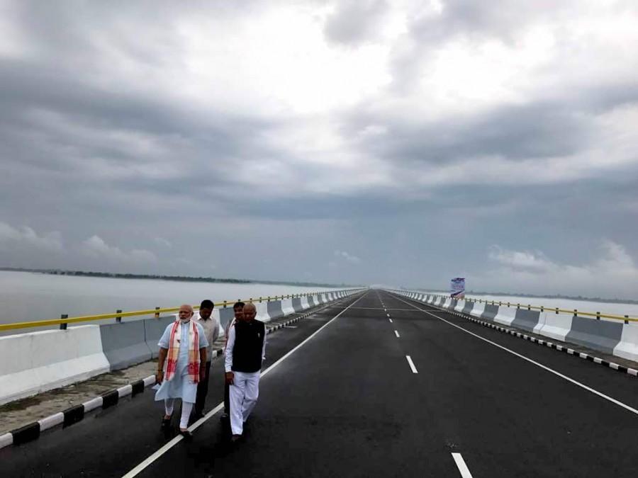 Prime Minister Narendra Modi on Friday inaugurated India's longest river bridge here in Assam. The over 9.2 km long Dhola-Sadiya bridge, built on the Lohit river, a tributary of the Brahmaputra, will connect Assam and Arunachal Pradesh. Narendra Modi,PM Narendra Modi,Modi,India's longest river bridge,Dhola-Sadiya,Brahmaputra,Assam and Arunachal Pradesh
