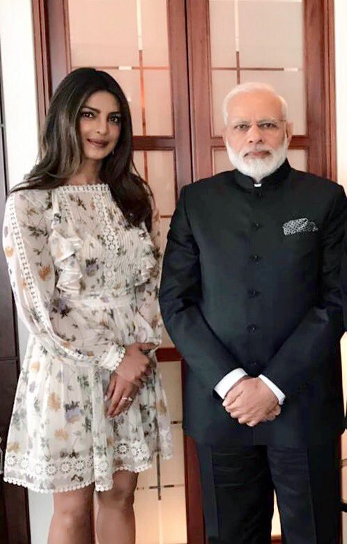 Priyanka Chopra on Tuesday met Prime Minister Narendra Modi, in between his packed schedule in Berlin, terming it "such a lovely coincidence". "Thank you for taking the time to meet me this morning Narendra Modi sir. Such a lovely coincidence to be in Berlin at the same time," Priyanka, who has been making India proud in Hollywood, tweeted. She even shared a glimpse from her meeting with Modi on Twitter as well as Instagram. The actress, who is known for her acting skills as well as supporting social and humanitarian causes, is seen in a white dress with a floral print during the meeting. Priyanka Chopra,Narendra Modi,Priyanka Chopra meets Narendra Modi,Priyanka Chopra meets Modi,Narendra Modi in Berlin,Actress Priyanka Chopra