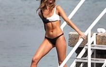 Millie Mackintosh flaunts her toned abs and enviable physique in a tiny bikini.