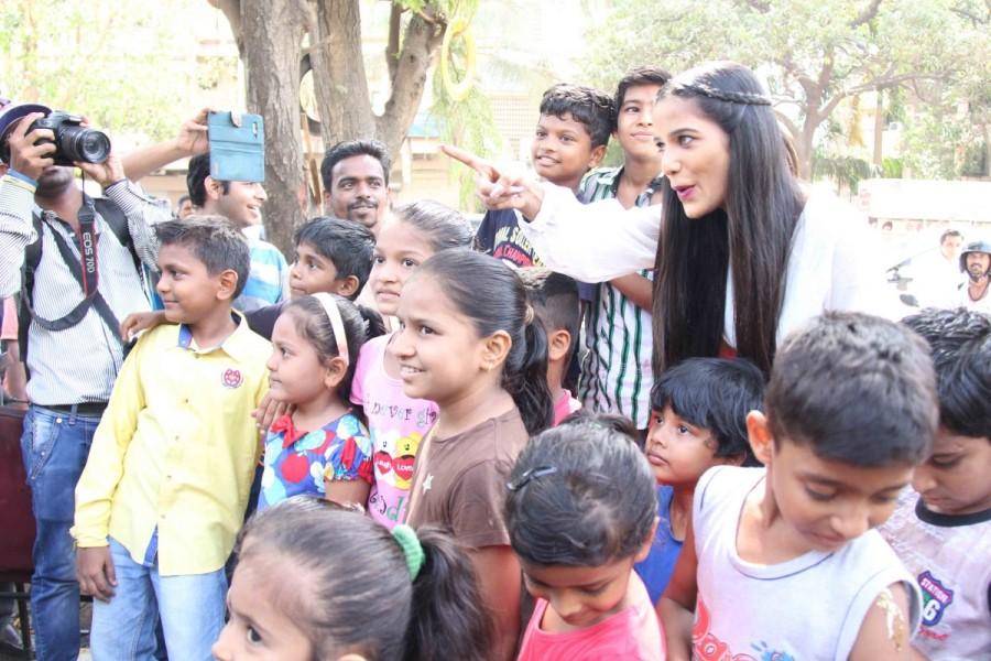 Actress Poonam Pandey poses for the photographers after distributing raincoats to street children in Mumbai on May 31, 2017. Poonam Pandey,actress Poonam Pandey,Poonam Pandey distribute raincoats to street children,Poonam Pandey distribute raincoats,Poonam Pandey new pics,Poonam Pandey new images,Poonam Pandey new stills,Poonam Pandey new PICTURES,Poonam Pandey new photos