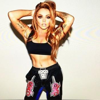 Jesy Nelson shows off her flat stomach.