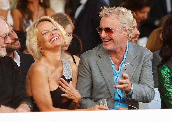 Pamela Anderson (L) and Eddie Irvine attend the Amber Lounge Fashion Monaco 2017 at Le Meridien Beach Plaza Hotel on May 26, 2017 in Monaco, Monaco. Bella Hadid,Will Smith,Pamela Anderson,Priyanka Chopra,Dwayne Johnson,Party Like a Celebrity