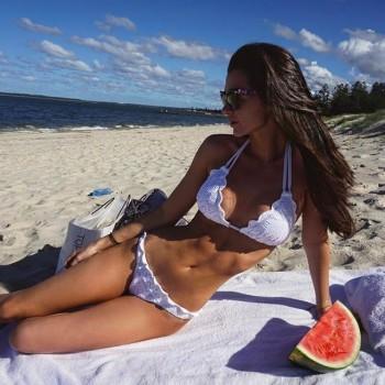 Emma McVey looks sensational as she flaunts her toned abs in white bikini.