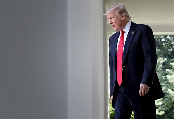 President Donald Trump arrives to announce his decision to withdraw the United States from the Paris climate agreement in the Rose Garden at the White House June 1, 2017 in Washington, DC. Trump pledged on the campaign trail to withdraw from the accord, which former President Barack Obama and the leaders of 194 other countries signed in 2015. The agreement is intended to encourage the reduction of greenhouse gas emissions in an effort to limit global warming to a manageable level. President Donald Trump,Donald Trump,Paris Climate Accord,Barack Obama,Donald Trump withdraws from Paris Climate Accord