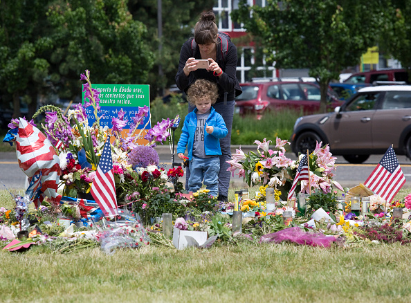 A woman takes her son to see an impromptu memorial at the Hollywood Transit Center on June 2, 2017 in Portland, Oregon. The center was the site where last week three men were stabbed, two fatally, after they stood up for two women who were being harassed on a MAX train. Ricky Best and Taliesin Myrddin Namkai Meche,Ricky Best,Taliesin Myrddin Namkai Meche,MAX train,Train Victims,Portland Honors MAX Train Victims
