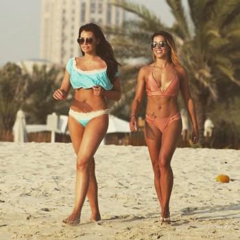 Reality star Jessica Wright flaunts her toned abs with her personal trainer in Dubai.