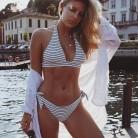 Instagram sensation Natasha Oakley flaunts her ample cleavage in a bikini.