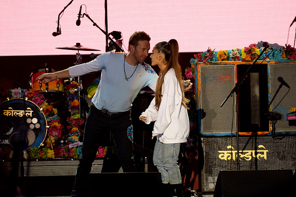 Chris Martin and Ariana Grande perform on stage on June 4, 2017 in Manchester, England. Liam Gallagher,Chris Martin,Ariana Grande,Miley Cyrus,One Love Manchester Benefit Concert,One Love Manchester