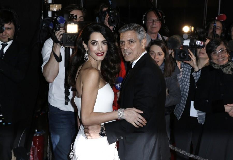 Actor George Clooney and his wife Amal pose as they arrive at the 42nd Cesar Awards ceremony in Paris, France, February 24, 2017. Amal Clooney,George Clooney,Amal and George Clooney welcome twins,Amal Clooney welcome twins,George Clooney welcome twins
