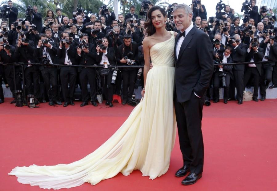 George Clooney and Amal pose on the red carpet for the screening of the film "Money Monster" out of competition at the 69th Cannes Film Festival in Cannes. Amal Clooney,George Clooney,Amal and George Clooney welcome twins,Amal Clooney welcome twins,George Clooney welcome twins