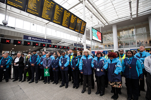 Railway staff and commuters pause during a minute's silence for the victims of the June 3rd terror attacks at London Bridge Station on June 6, 2017 in London, England. Seven people were killed and at least 48 injured in terror attacks on London Bridge and Borough Market on June 3rd. Three attackers were shot dead by armed police. London Bridge Terror Attack,London Bridge,victims of London Bridge terror attack,Minute's silence held for victims of London Bridge terror attack