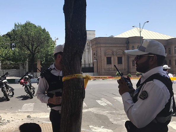 Police take security measures at the scene after gunmen opened fire at Irans parliament and the shrine of Ayatollah Khomeini in the capital Tehran, Iran on June 7, 2017. Gunmen attack,Gunmen attack Iranian parliament,Iranian parliament,Iranian Parliament building,Khomeini shrine,Tehran