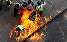 Riot security forces members catch fire during riots at a rally against Venezuelan President Nicolas Maduro's government in Caracas, Venezuela, June 7, 2017.