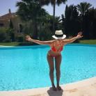 Irish model Vogue Williams flaunts her incredible body in red bikini.