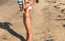 Hilaria Thomas Baldwin flaunts her bikini body as she hits the beach with Alec and the kids.