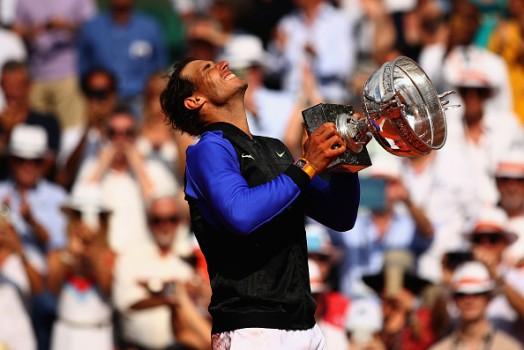Spaniard Rafael Nadal became the first tennis player to win 10 titles in any Grand Slam tournament in the Open Era as he outclassed Stanislas Wawrinka at the French Open final here on Sunday.