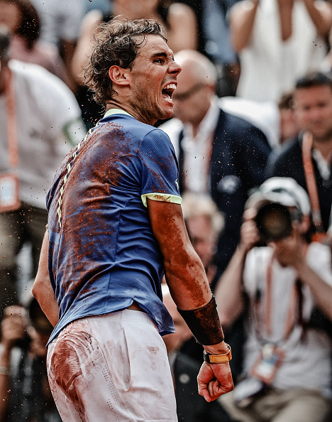 Rafael Nadal of Spain falls backwards after victory during his match against Stan Wawrinka of Switzerland during the Men's Singles Final, on day fifthteen at Roland Garros on June 11, 2017 in Paris, France. Rafael Nadal,Spaniard Rafael Nadal,Rafael Nadal wins 10th French Open title,French Open title,Rafael Nadal tenth French Open title,French Open title 2017