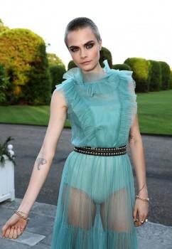 English fashion model and actress Cara Jocelyn Delevingne flaunts her tattoo at Save the Elephants event.