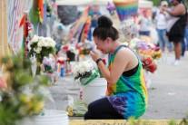 Chelsea Nylen reacts while visiting the memorial outside the Pulse Nightclub on the one-year anniversary of the shooting in Orlando, Florida.