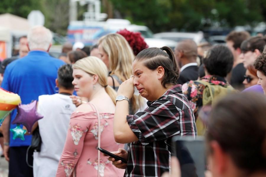 Guests react to the memorial outside the Pulse Nightclub. Orlando,Orlando Pulse nightclub massacre,Pulse nightclub massacre,Pulse nightclub,first anniversary of Orlando's Pulse nightclub,Pulse Nightclub,pulse nightclub shooting