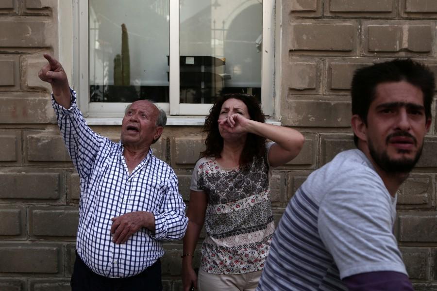 People react at the village of Plomari on the Greek island of Lesbos, Greece, after a strong earthquake shook the eastern Aegean. Earthquake strikes Greek,Earthquake strikes Lesbos,Greek island,Greek island of Lesbos
