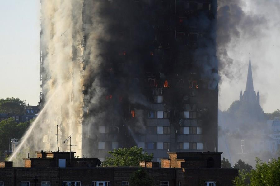 The firefighters were battling to rescue people trapped inside the tower block in west London, The Guardian reported. The fire in the 24-storey Grenfell Tower on Latimer Road near Notting Hill started in the early hours of Wednesday. London apartment building,London apartment,West London apartment fire,massive fire in London,massive fire in London apartment building,massive fire in London apartment