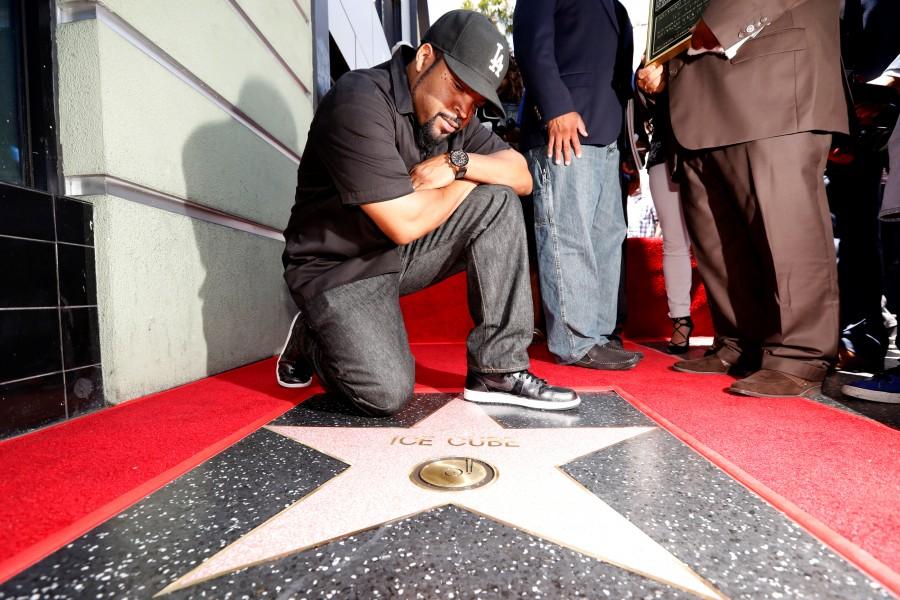 Rapper Ice Cube poses by his star after it was unveiled. Ice Cube,Ice Cube gets Star on Hollywood Walk of Fame,Hollywood Walk of Fame,Star on Hollywood Walk of Fame,Ice Cube Gets Star on Walk of Fame,actor Ice Cube,Hollywood Walk of Fame pics