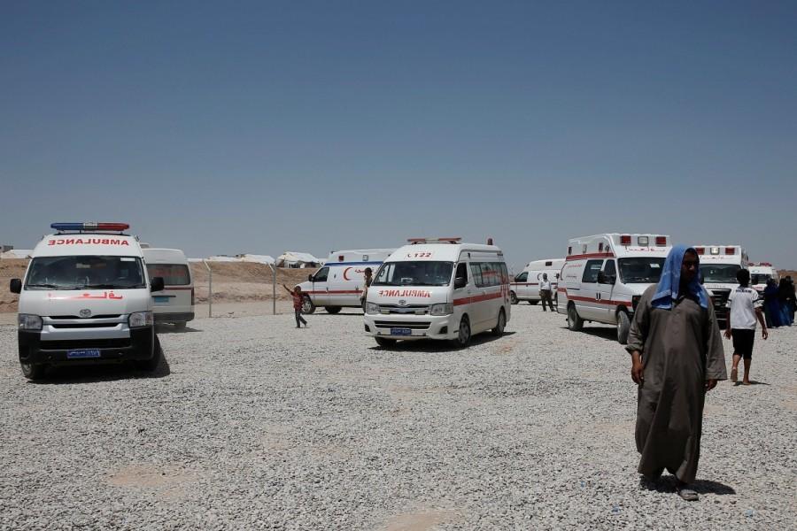 Ambulances are parked at the Hasansham U2 camp where more than 300 people fell ill in a mass outbreak of food poisoning, in al-Khazer, east of Mosul, Iraq June 13, 2017. Food poisoning outbreak,Food poisoning,Food poisoning outbreak at Iraqi camp,Iraqi camp,Food poisoning at Iraqi camp,Iraqi city,Mosul