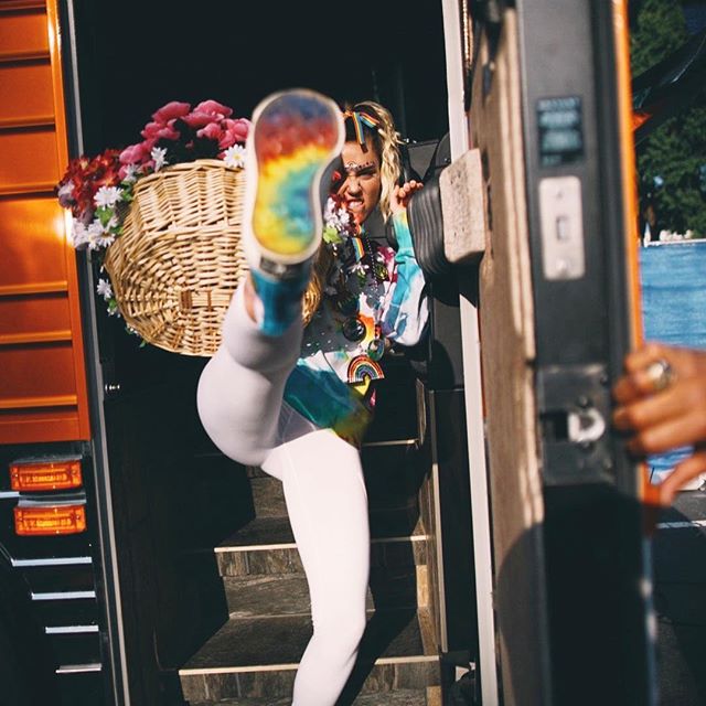Miley Cyrus continues to show her pride in a colorful get-up. Miley Cyrus,singer Miley Cyrus,Miley Cyrus colorful get-up,Miley Cyrus bikini pics,Miley Cyrus bikini images,Miley Cyrus bikini stills,Miley Cyrus curves,Miley Cyrus curves pics,Miley Cyrus flaunts curves,Miley Cyrus hot pics,Miley Cyrus hot images,Miley