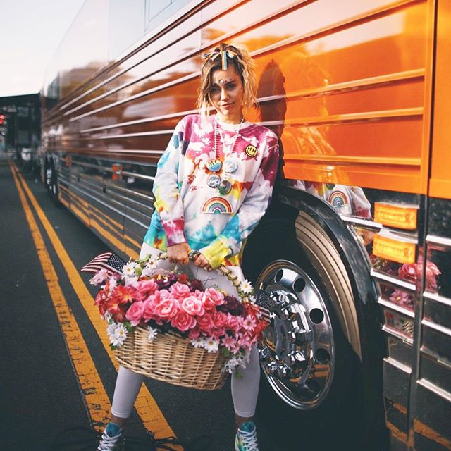 Miley Cyrus continues to show her pride in a colorful get-up. Miley Cyrus,singer Miley Cyrus,Miley Cyrus colorful get-up,Miley Cyrus bikini pics,Miley Cyrus bikini images,Miley Cyrus bikini stills,Miley Cyrus curves,Miley Cyrus curves pics,Miley Cyrus flaunts curves,Miley Cyrus hot pics,Miley Cyrus hot images,Miley