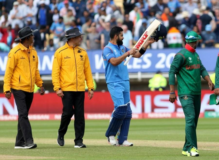 At the other end, Sharma clipped Shakib Al Hasan down to long-on to bring up his third half century of the tournament. India got to 100/1 in 16.2 overs with Kohli joining him in the middle and announcing his arrival with a Sachin Tendulkar-esque straight drive down the ground off Mustafizur. He followed it up with two more boundaries off the same bowler one over later including a magnificient cover drive. At the halfway stage of the innings, India were cruising at 164/1 needing another 101 runs for victory when Sharma hooked Mustafizur for a six to bring up his century. Earlier, riding on fluent half centuries from opener Tamim Iqbal and stumper Mushfiqur Rahim, Bangladesh posted 264/7. Tamim (70) and Mushfiqur (61) posted a 123-run third-wicket partnership to steady the Bangladesh ship after the tigers were reduced to 36/2. Champions Trophy 2017,ICC Champions Trophy 2017,India defeat Bangladesh,India beat Bangladesh,ICC Champions Trophy,India vs Pakistan,india vs pakistan champions trophy 2017