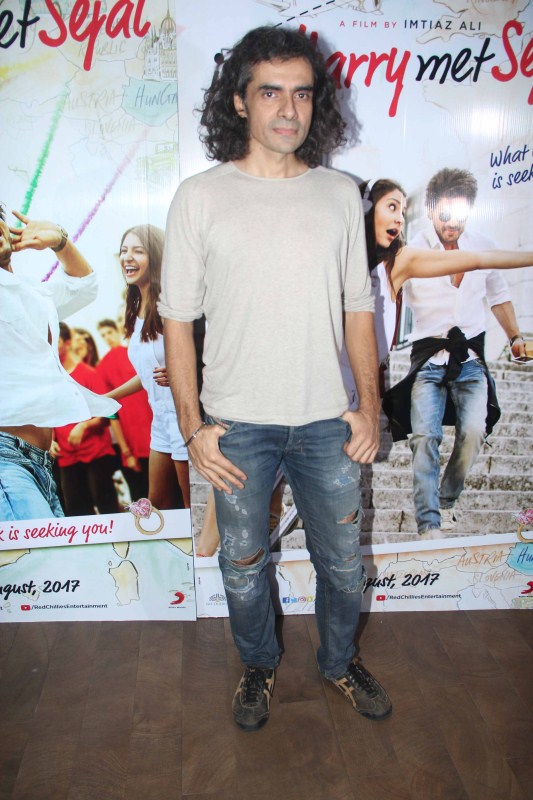 Filmmaker Imtiaz Ali during the mini trailer launch of film Jab Harry Met Sejal in Mumbai. Shah Rukh Khan and Imtiaz Ali,Shah Rukh Khan,Imtiaz Ali,Anupama Chopra,Jab Harry Met Sejal mini trailer launch,Jab Harry Met Sejal trailer launch,Jab Harry Met Sejal trailer launch pics,Jab Harry Met Sejal trailer launch images,Jab Harry Met Sejal trailer