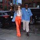 Supermodel Gigi Hadid wears eclectic dress as she tries to stay dry.