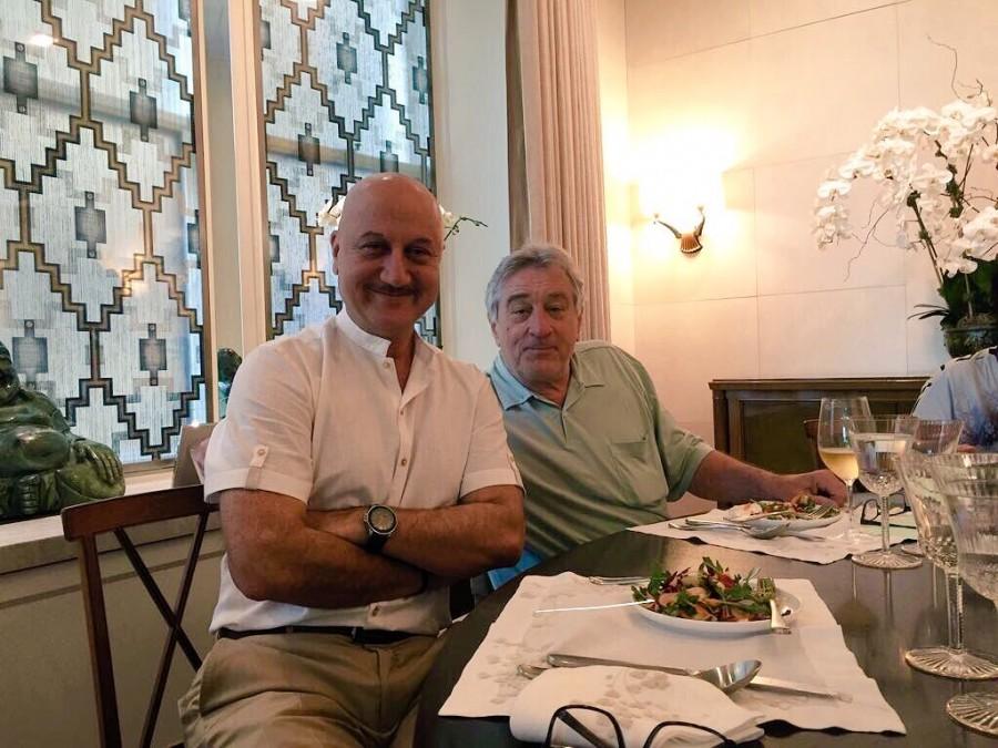 Veteran actor Anupam Kher met Hollywood star Robert De Niro, with whom he starred in "Silver Linings Playbook", over lunch here. Anupam on Monday took to Twitter to share a string of photographs from De Niro's home. The 62-year-old actor is seen wearing a white shirt and beige pants, while the Hollywood star donned a mint green t-shirt and pants. Anupam Kher meets Robert De Niro,Anupam Kher,Robert De Niro,Anupam Kher with Robert De Niro,hollywood actor Robert De Niro,bollywood actor Anupam Kher,Silver Linings Playbook