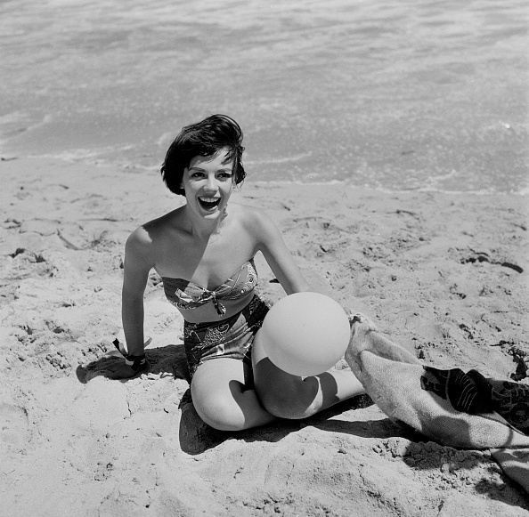 Actress Natalie Wood plays in the sand during the Thalians Beach Ball in Malibu, California. Beach Babes,Beach Babes pics,Beach Babes images,Beach Babes stills,Beach Babes pictures,Beach Babes photos,Beach Babes hot pics,Beach Babes hot images,Beach Babes hot stills,Beach Babes hot pictures