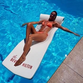 Photos of Lucy Mecklenburgh flaunts her enviably toned and tanned frame in skimpy coral bikini.